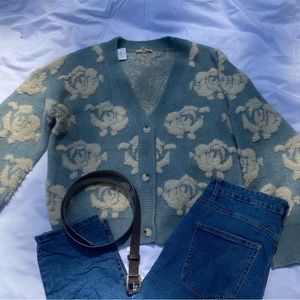 Cozy blue sweater with floral fuzzy detailing